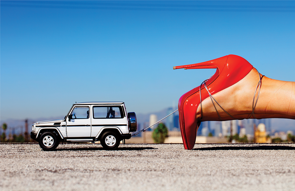 Mercedes G-Wagon towing a woman in red heels